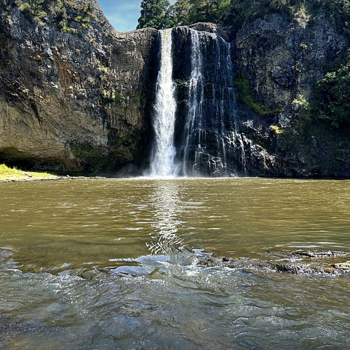 Hunua Falls cascading into a pool near Auckland